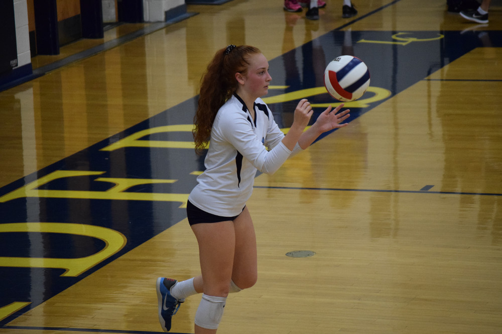 Stone Bridge senior libero Ryley Gill controlled the back row defense for the Lady Bulldogs with 18 digs while adding 5 assists. Photo by Owen Gotimer.