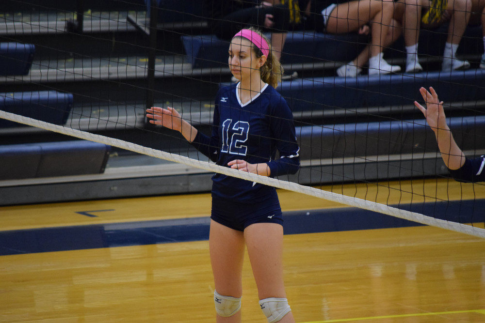 Stone Bridge senior opposite Gabbie Scudder led the Lady Bulldogs with 13 kills, but her effort was not enough against the dynasty Lady Raiders. Photo by Owen Gotimer.